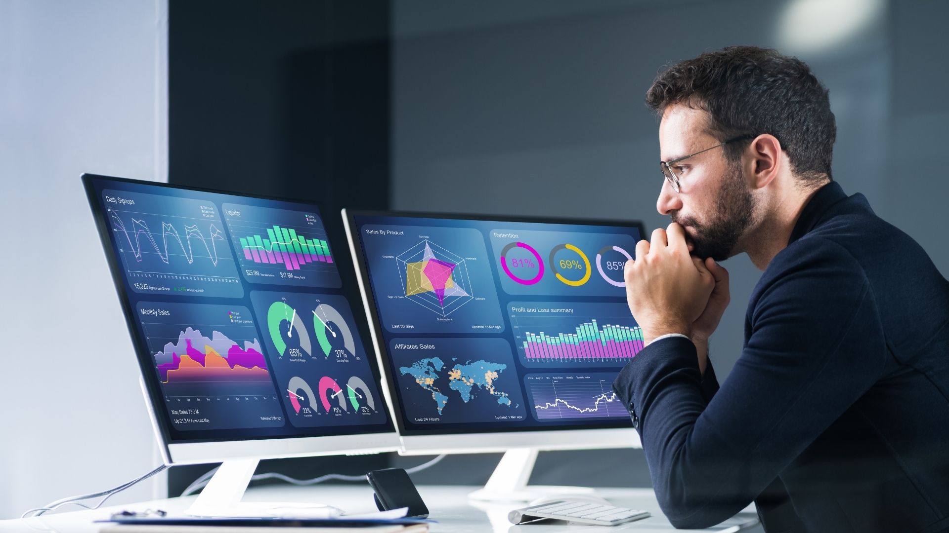 Man looks at data on his computer screen.