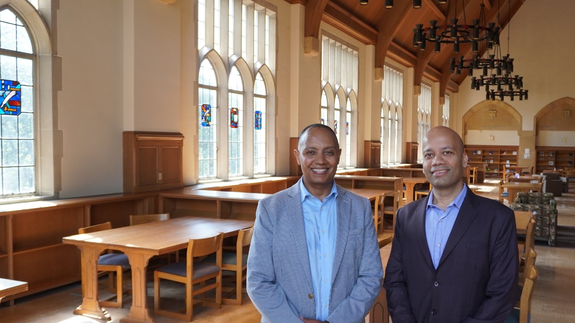 Dr. Manjeet Rege and Jote Taddese in the O'Shaughnessy Library