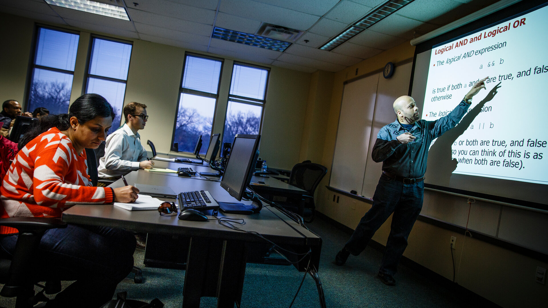 Dr. Manjeet Rege teaches a class of graduate students.