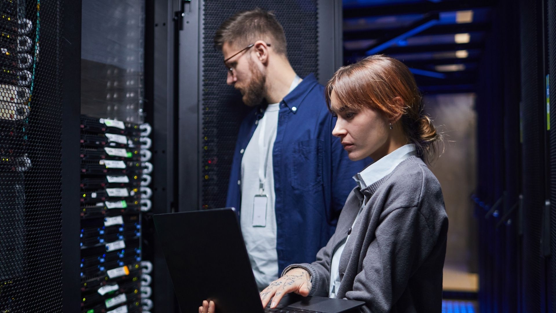 Students in front of a large computer server. 