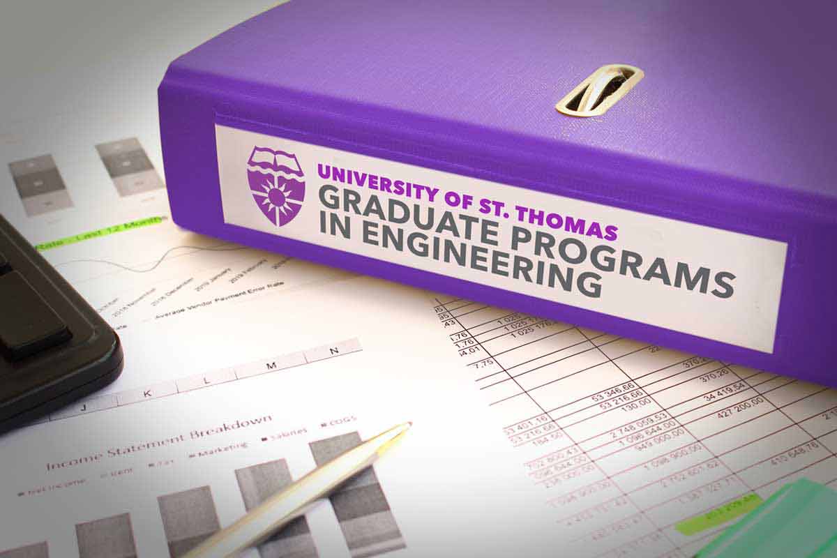 Folder, pages and pen on table with label Graduate Programs in Engineering